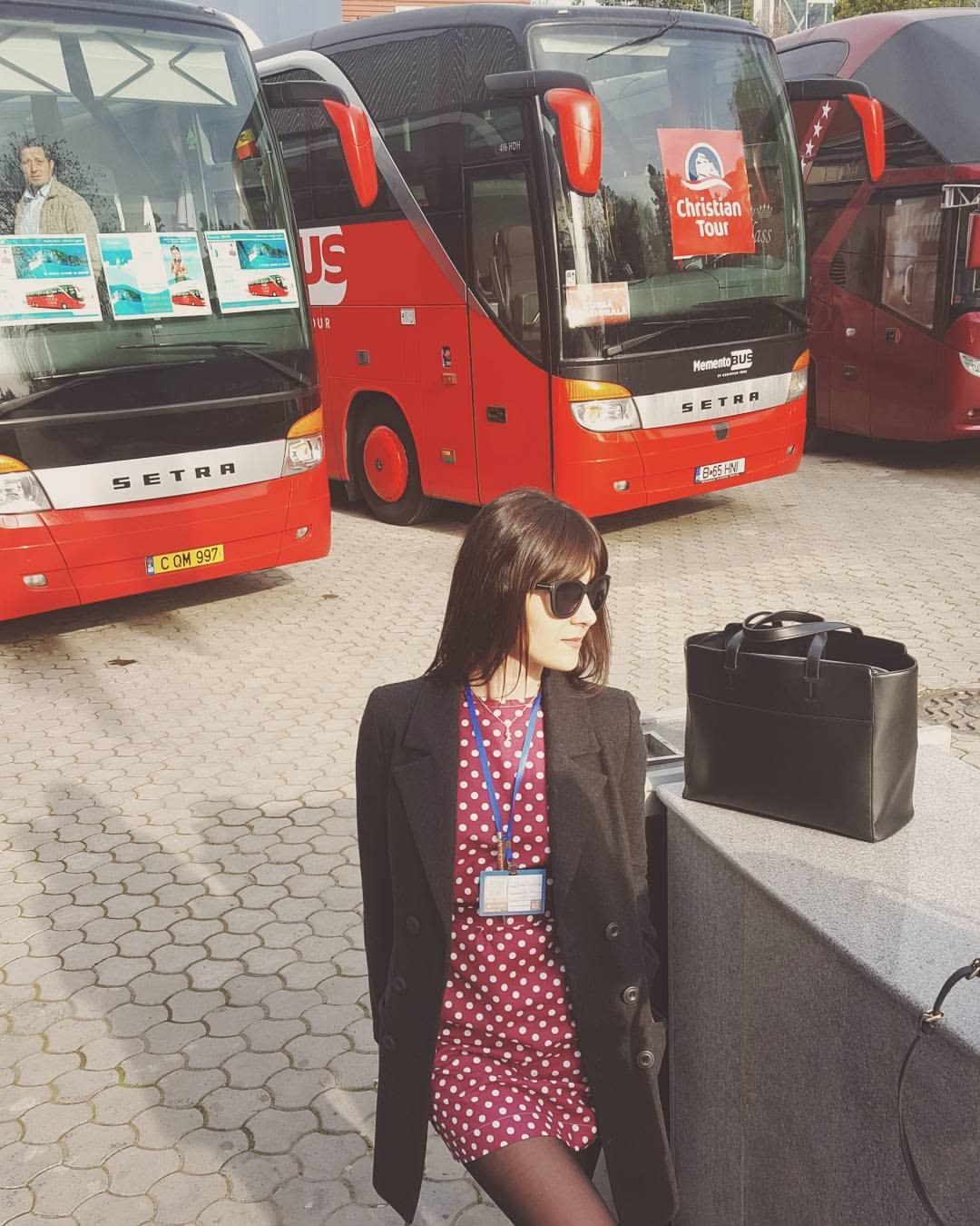 An archive photograph beside coaches with Christian Tour branding.